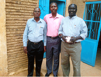 Dr Hedrick Mahlangu (left) with the regional coordinator (centre) and a local colleague during a community field visit.
